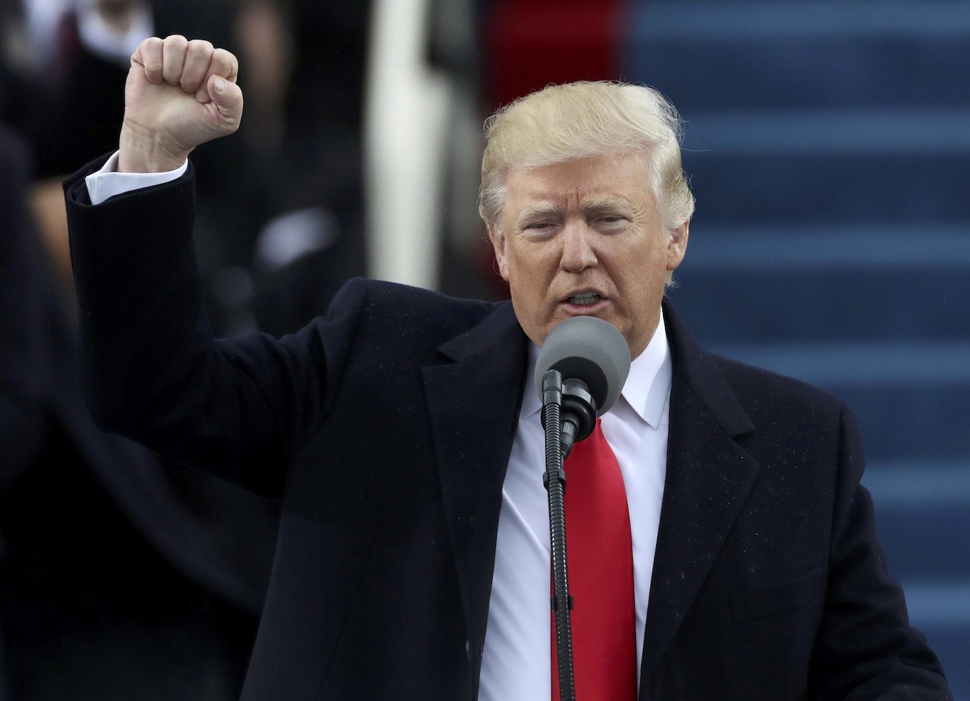 U.S. President Donald Trump raises his fist after being sworn in as the 45th president of the United States on the West front of the U.S. Capitol in Washington